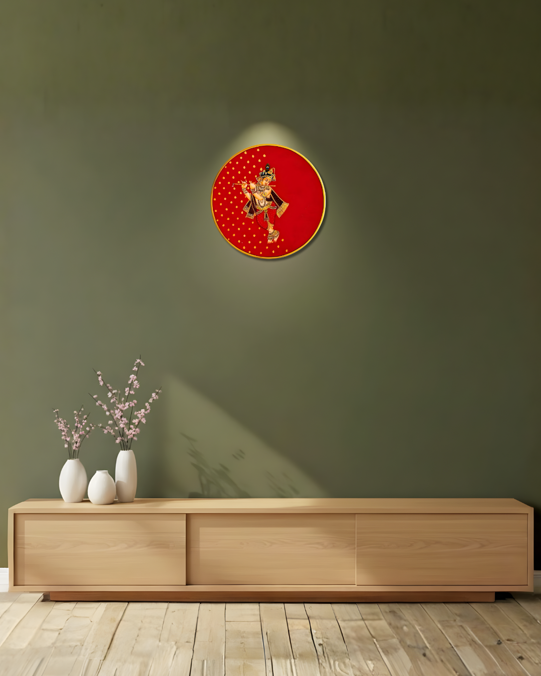 Decorative wall piece with a red face and gold accents_Murlidhar Shyaam_pichwai plate