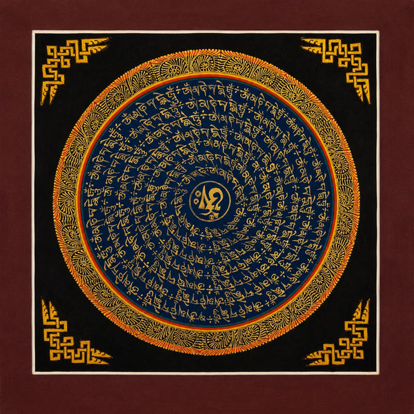 Handcrafted Tibetan mantra wall art with gold script on blue, black, and orange mandala design