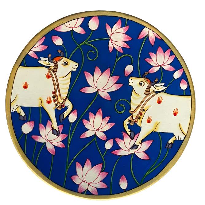 Decorative plate with two cows and pink flowers on a blue background_The Leelas of Vrindavan_pichwai plate